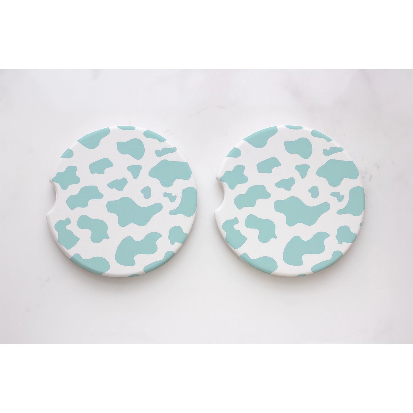 Load image into Gallery viewer, Teal Cow Print Car Coasters
